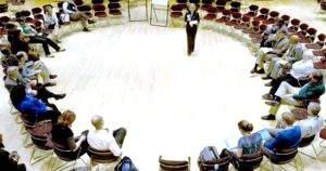 photo of presenters and listeners in a circle